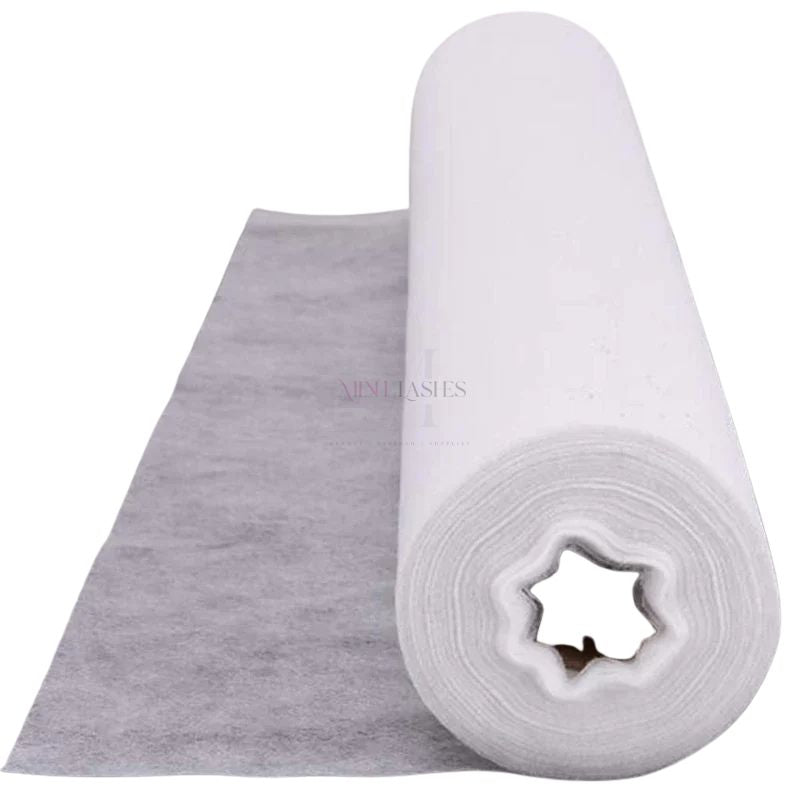 Disposable non-woven beauty bed sheet roll for lash salons and beauty clinics, soft breathable fabric, hygienic and skin-friendly by Minh Lashes Beauty Supplies.