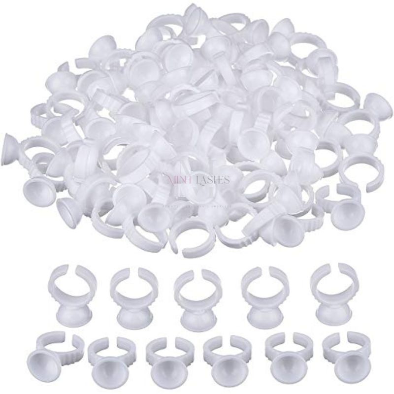 Bulk quantity of disposable plastic ring cups for professional beauty and cosmetic applications.