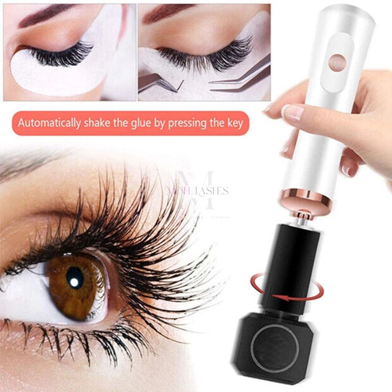 White rechargeable electric eyelash glue shaker set with adapter heads for professional lash technicians.