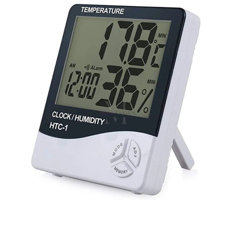 Side view of HTC-1 digital humidity and temperature clock placed on a workstation in a lash extension room.