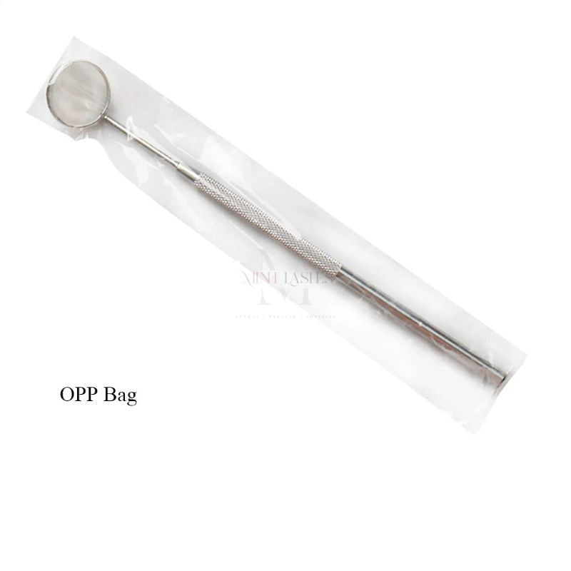 Individually packaged stainless steel eyelash inspection mirror in OPP bag.