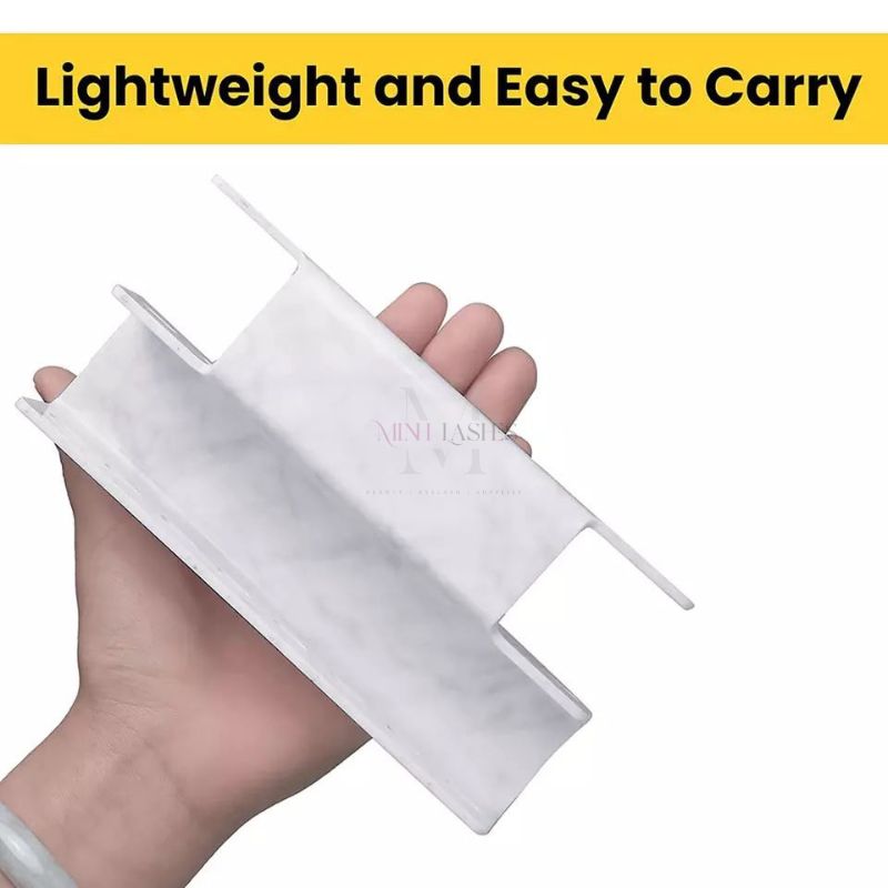 Lightweight marble tweezers stand by Minh Lashes held in hand for easy portability
