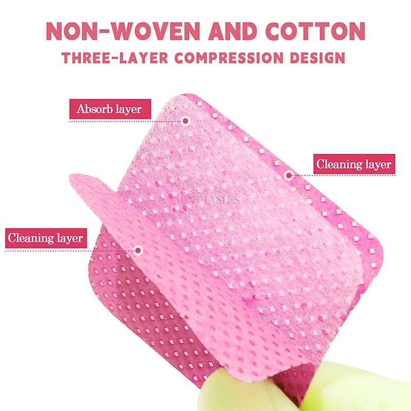 Three-layer non-woven eyelash cleaning pad showing absorbent and cleaning layers for professional lash glue removal.